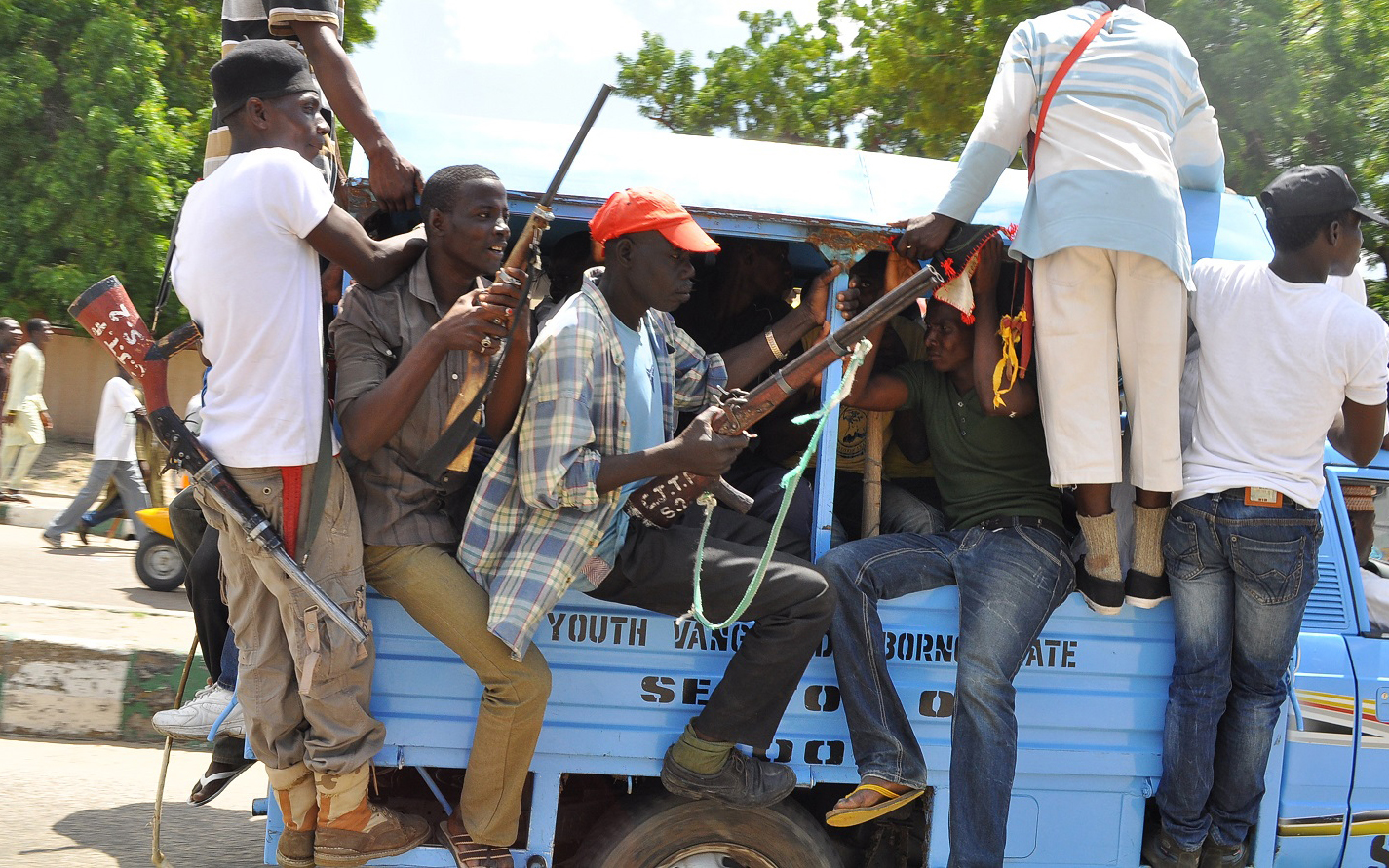 Vigilante and local hunters armed with guns patrol the streets of Maiduguri, Nigeria, Thursday, Sept. 4, 2014. The United States is preparing to launch a "major" border security program to help Nigeria and its neighbors combat the increasing number and scope of attacks by Islamic extremists, a senior U.S. official for Africa said Thursday. Nigerian insurgents have begun attacking villages in neighboring Cameroon and have been seizing land in northeast Nigeria where they proclaimed an Islamic caliphate. (AP Photo/Jossy Ola)