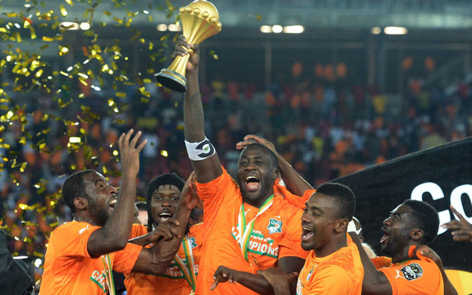 (FILES) This file photo taken on February 10, 2015 shows Ivory Coast's midfielder Yaya Toure (C) raising the trophy at the end of the 2015 African Cup of Nations final football match between Ivory Coast and Ghana in Bata on February 8, 2015. Four-time African footballer of the year Yaya Toure of the Ivory Coast announced his retirement from international football on September 20, 2016. / AFP PHOTO / KHALED DESOUKI